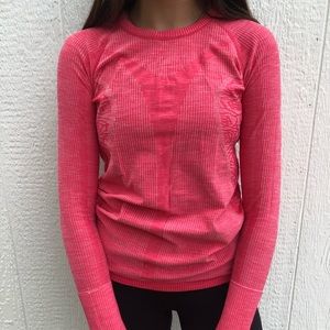 Barley worn hot pink lululemon long sleeve.